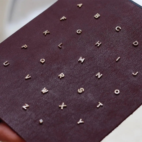 Small initial letter stud earrings with zircons